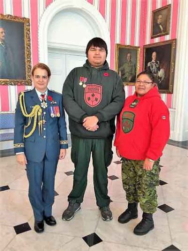 Governor General Julie Payette, left, with Junior Canadian Ranger Trevor McKay, and Master Corporal Karen Meeseetawageesic.