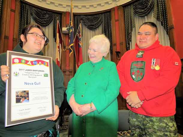 Junior Canadian Ranger Nova Gull of Peawanuck, received an Indigenous writing award yesterday from Ontario Lieutenant-Governor Elizabeth Dowdeswell, centre. Nova's father, Sergeant Matthew Gull of the Canadian Rangers, is at right.  credit Sergeant Peter Moon, Canadian Rangers