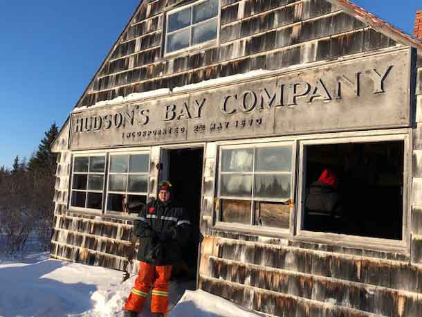 Junior Canadian Ranger Nova Gull in front of the abandoned Hudson's Bay Company trading post at Lake River in Polar Bear Provincial Park. credit: Canadian Rangers