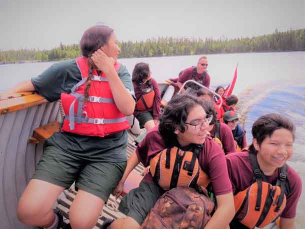 Junior Canadian Rangers react to a fast boat turn.