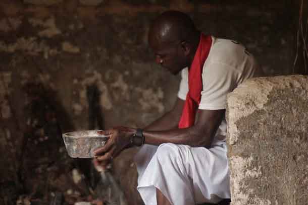 Juju priest David Ubebe performing a ceremony in his shrine, Benin, Nigeria, July 1, 2018. Thomson Reuters Foundation/Kagho Idhebor