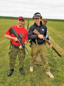 Corporal Jordan Ayearst holds an Australian Steyr AUG assault rifle while Sergeant Tom Squires of the Australian Defence Force holds a Canadian Ranger .303 bolt action rifle.