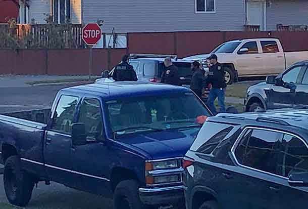Police with suspect in custody on Dease Street