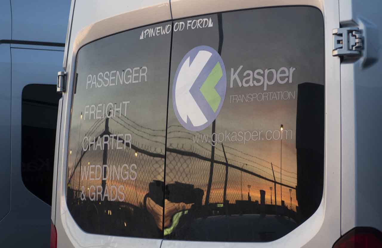 Kasper Transportation bus with sunset in back window