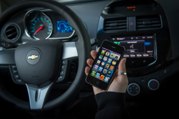 Customers with a compatible iPhone running iOS 6 can direct Siri to perform tasks while they safely keep their eyes on the road and their hands on the wheel. (Photo by Steve Fecht for Chevrolet)