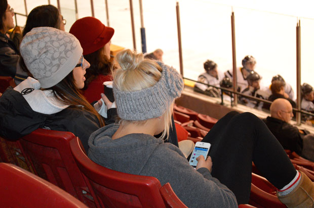 Teens on their Iphones while watching the SIJHL is very common