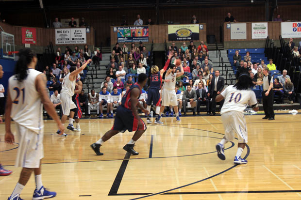 Lakehead Thunderwolves Ryan Thompson passes to Greg Carter in action at the Thunder Dome - Photo by Lynda Henshell