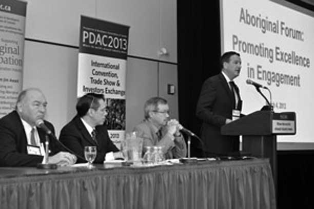 Parliamentary Secretary Greg Rickford speaking at the Prospectors and Developers Association Conference, with (from left to right): Premier McLeod, NWT, Micheal Fox, Fox High Impact Consulting and Donald Bubar, Avalon Rare Metals Inc.