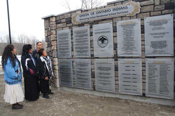 Anishinabek Nation Grand Council Chief Patrick Madahbee with Indian Residential School survivor Charlotte Contin and her daughters Dot and Judy.