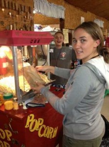 Camp Quality 2013 Meagen makes popcorn with Braeden getting in the act.