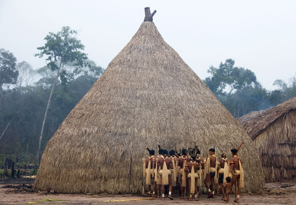 Brazil's Enawene Nawe gather outside haiti, the house of sacred flutes, to celebrate their four-month long Yãkwa fishing ritual.