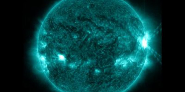 An X1.0-class flare exploded off the right side of the sun, peaking at 10:03 p.m. EDT on Oct. 27, 2013. This image was captured by NASA's Solar Dynamics Observatory in the 131 Angstrom wavelength, which is particularly good for showing solar flares and is typically colorized in teal. Credit: NASA/SDO