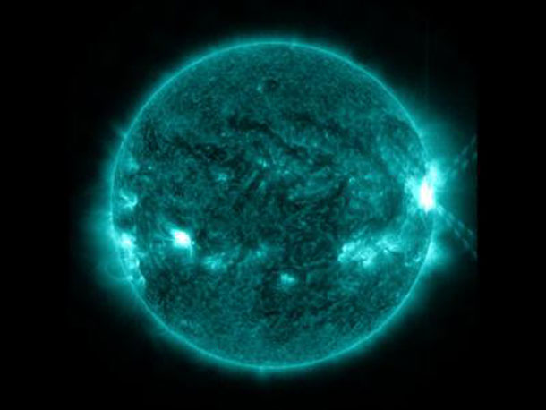 An X1.0-class flare exploded off the right side of the sun, peaking at 10:03 p.m. EDT on Oct. 27, 2013. This image was captured by NASA's Solar Dynamics Observatory in the 131 Angstrom wavelength, which is particularly good for showing solar flares and is typically colorized in teal. Credit: NASA/SDO