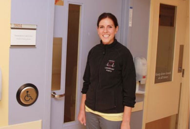 ICU nurse Kayley Heppler shows the new automatic door opener that allows family and visitors with mobility challenges to enter and exit the ICU more easily. Funding for the door opener was provided thanks to a Volunteer Association/Thunder Bay Regional Health Sciences Foundation Family CARE Grant.