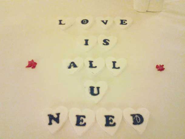 These letters were personally cut out of Styrofoam in heart shapes by my personal butler. He expressed concern for some people's sensitivities to scents and wanted an alternative greeting to handpicked flowers from the resorts lavish gardens.