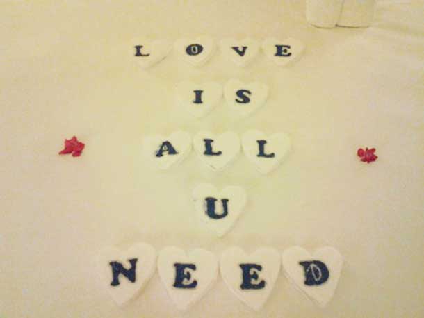 These letters were personally cut out of Styrofoam in heart shapes by my personal butler.  He expressed concern for some people's sensitivities to scents and wanted an alternative greeting to handpicked flowers from the resorts lavish gardens.