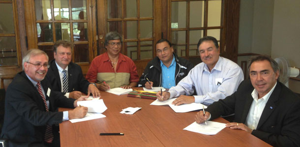From left to right are Professor Lee Stuesser, Founding Dean of Lakehead University’s Faculty of Law; Lakehead President and Vice-Chancellor Dr. Brian Stevenson; Deputy Grand Chief Goyce Kakegamic, Nishnawbe Aski Nation; Chief Gary Allen from Treaty #3 (signing on behalf of Grand Chief Warren White); Regional Grand Chief Peter Collins from the Union of Ontario Indians; and President Gary Lipinski from Métis Nation of Ontario.