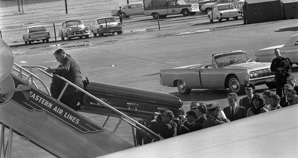 The body of President Kennedy in a coffin being loaded aboard Air Force One - John F. Kennedy Presidential Library