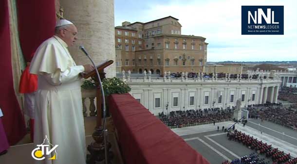 Pope Francis delivering message from balcony in the Vatican.