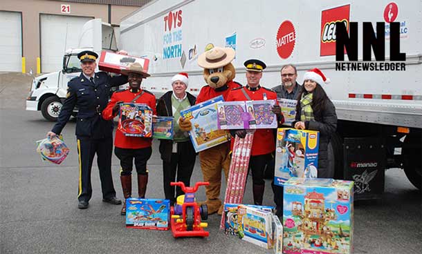Thomson Terminals: November 26, 2013. L-R: Sgt. Richard Rollings, Cst. Stuart Philp, Gary Rodrigue (Thomson Terminals), Safety Bear, Insp. Gilmore, Al Russell, Laura Wiese (Canadian Toy Association)