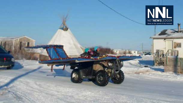 Contact.... contact... the airplane having fun in the Attawapiskat Christmas Parade. Photo by Rosiewoman Cree.