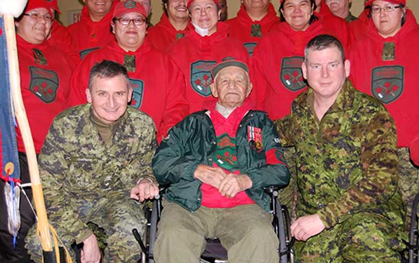 Ranger Abraham Metawabin is surrounded by fellow Canadian Rangers and military officers after receiving a first bar to his Canadian Forces Decoration for his long military service. Photo: Captain Robert Munroe, Canadian Rangers