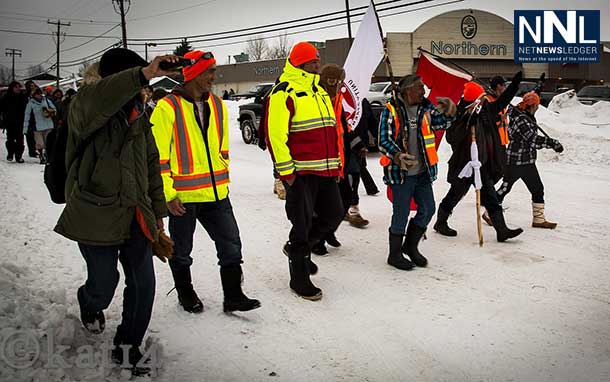 "The Walkers" appear to be smitten with the high level of adulation and warm response from the community of Moosonee upon their arrival. — in Moosonee. Photo by Chris Kat.