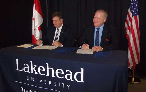 Lakehead University President and Vice-Chancellor, Dr. Brian Stevenson, left, and Dr. Michael Hawes, CEO and Executive Director of Canada-U.S. Fulbright Program, signed a memorandum of understanding on Friday, Jan. 10, 2014. - Photo Brandon Walker LU