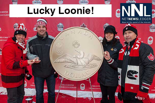 Jean-Luc Brassard, Assistant Chef de Mission, Blake Richards, MP for Wild Rose, Christine Aquino, Director of Communications and Public Affairs at the Royal Canadian Mint and Steve Podborski, Sochi 2014 Chef de Mission unveil the 2014 Lucky Loonie circulation coin at the Canadian Olympic Team's Sochi Block Party event in Banff, Alberta