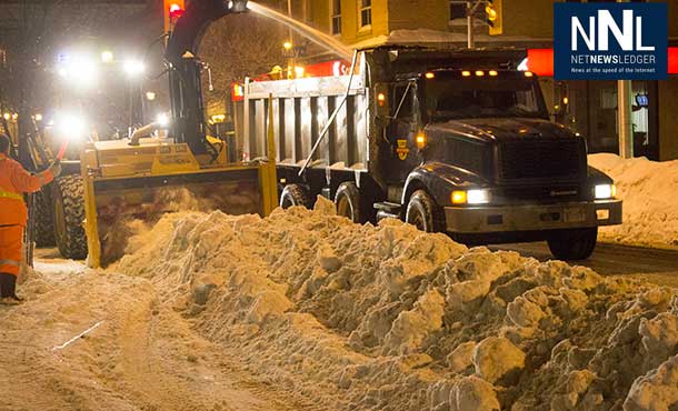 Snowbanks have to be ploughed out into the street and then huge snowblowers remove the snow into dump trucks.