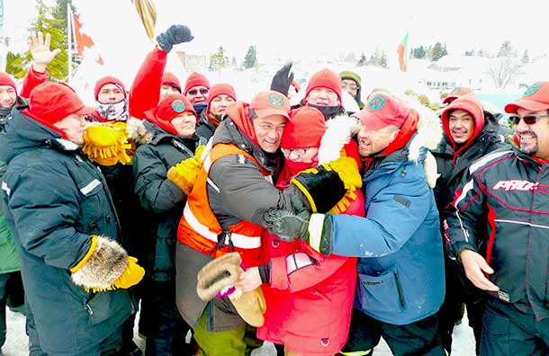 Canadian Rangers celebrate their patrol's arrival in Cochrane, Ont., to open the town's winter carnival. Photo Sergeant Peter Moon.