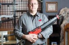 JR Cox, owner of The Shooting Edge with a Swiss Arms rifle. The RCMP has changed its mind on Swiss Arms rifles — where once they were legal they have now been reclassified as prohibited.