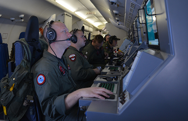 Crew members on board a P-8A Poseidon assigned to Patrol Squadron (VP) 16 man their workstations while assisting in search and rescue operations for Malaysia Airlines flight MH370. VP-16 is deployed in the U.S. 7th Fleet area of responsibility supporting security and stability in the Indo-Asia-Pacific. (U.S. Navy photo by Mass Communication Specialist 2nd Class Eric A. Pastor/Released)