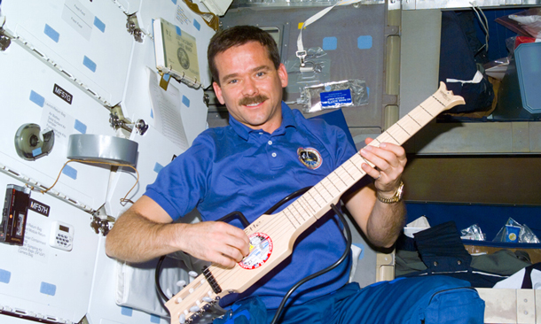 Astronaut Chris Hadfield in 1995 in space with a guitar. His love of music and teaching and engaging made his trip to the ISS historic.