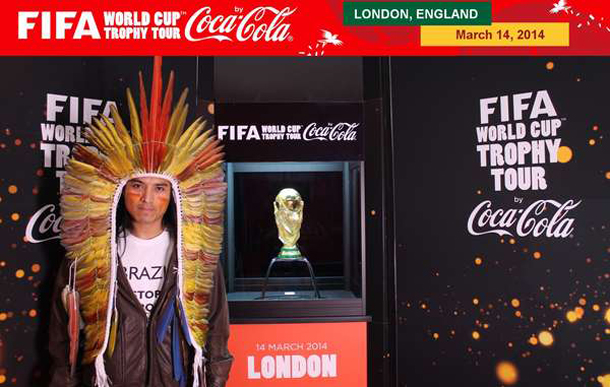 Nixiwaka Yawanawá wore a T-shirt saying ‘BRAZIL: STOP DESTROYING INDIANS’, but Coca-Cola and FIFA prevented him from displaying the full message while standing next to the trophy. © FIFA