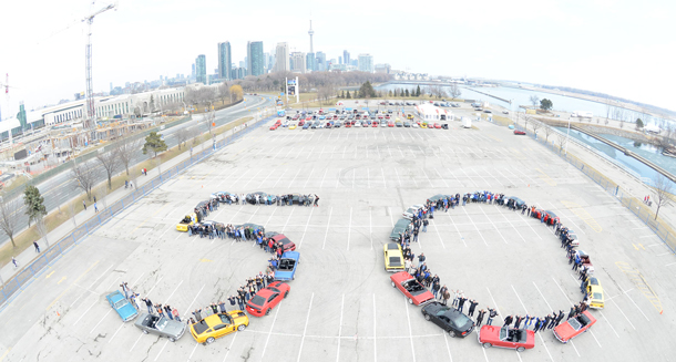 "50 years ago, on April 17, 1964, an automotive and pop culture icon was born. To celebrate, Ford of Canada and members of the Golden Horseshoe Mustang Association and GTA Mustang Club took an aerial shot of 25 classic Mustangs forming a '50' at Ontario Place in Toronto. Simultaneously, more than 100 additional Mustangs participated in a vintage car show at the same location. Image Ford Canada