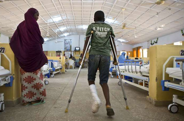 This 14-year-old boy was shot when gunmen attacked his school in Nigeria, killing three of his friends. His parents will take him away from the area. UN Photo/Isaac Billy