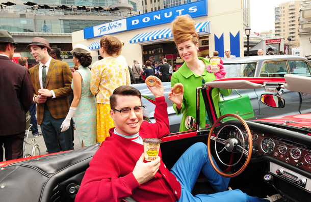 To celebrate its 50th birthday today, Tim Hortons thanked its loyal guests by treating them to birthday cake donuts in restaurants and creating an online video taking guests back in time to 1964