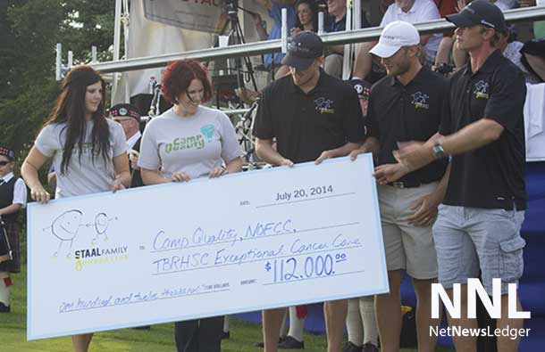 The Staal Brothers presenting a cheque to Camp Quality