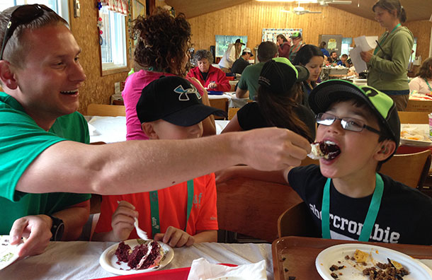 Two friends sharing some cake at Camp Quality 2014