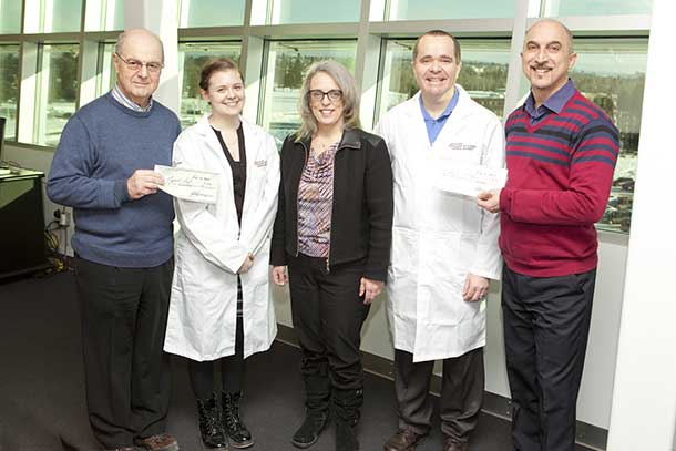 Roy Piovesana, far left, IIS-LU President, and John Bonofiglio, far right, Vice-President of IIS-LU, presented cheques to Margaret-Ashley Veall and Dr. Carney Matheson. In the middle is Laura Craig, Director of Research, Crupi Consulting Group. 