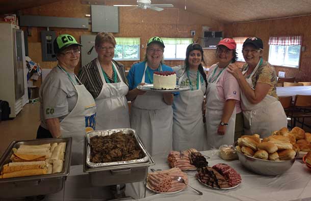 Camp Quality is fueled with food. Here the kitchen volunteers share their bounty.