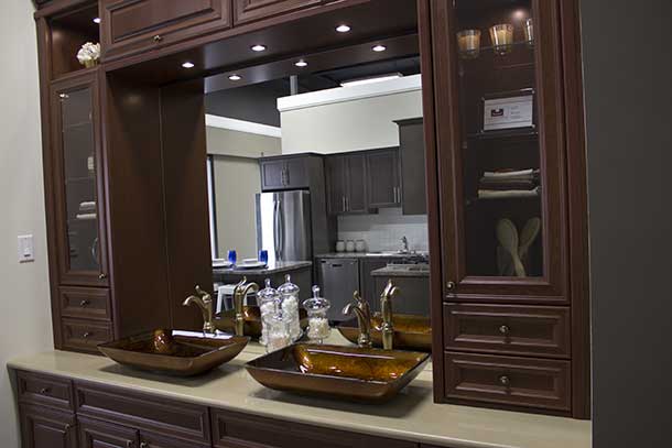 The well designed bathroom offers places for storage and classic looks