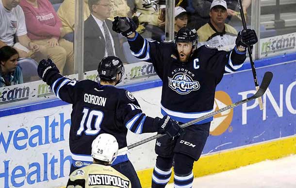 Victory: St John's IceCaps will remain in Mile One Centre for another two years. Above, Jason Jaffray, right, celebrates his goal with Andrew Gordon in the first period against the Wilkes-Barre/Scranton Penguins in game three of the AHL Eastern Conference finals in May.