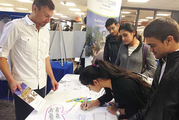 Students Share Their Sustainable Ideas for the City at the EarthCare Booth During the Student Union of Confederation College's Sustainability Fair.