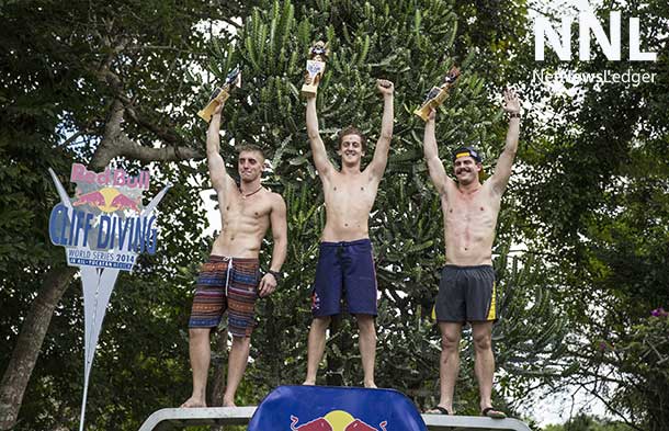 Second placed Artem Silchenko (L) of Russia, event and 2014 World Series winner Gary Hunt (C) of the UK, and third placed David Colturi (R) of the USA celebrate with their trophies during the seventh and final stop of the Red Bull Cliff Diving World Series, Ik Kil cenote, Yucatan, Mexico on October 18th 2014. Photographer: Romina Amato
