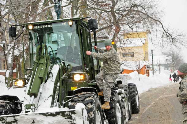 New York Army National Guardsmen employ engineering equipment to remove snow in Buffalo, N.Y., Nov. 20, 2014. More than 500 Guard members are supporting response and recovery efforts following historic amounts of snowfall in western New York State. U.S. Air National Guard photo by Senior Master Sgt. Ray Lloyd