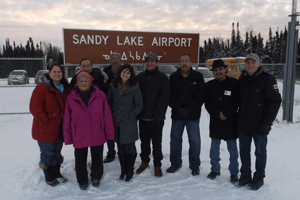 From Left-Jody-Lynn Waddilove, Elder Adelaide Meekis, John Cutfeet, Sam Achneepinescum, Meaghan Daniel, Jerry Sawanas,Terry Waboose,Chief Bart Meekis, Julian Falconer.