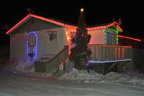 Dreamcatcher in lights on home in Attawapiskat - Photo by Rosiewoman Cree