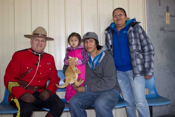 (l-r) RCMP S/Sgt. Normand Roy, Hailey Sakenee, Kurtis Meekis, and Cynthia Meekis in Landsdowne House